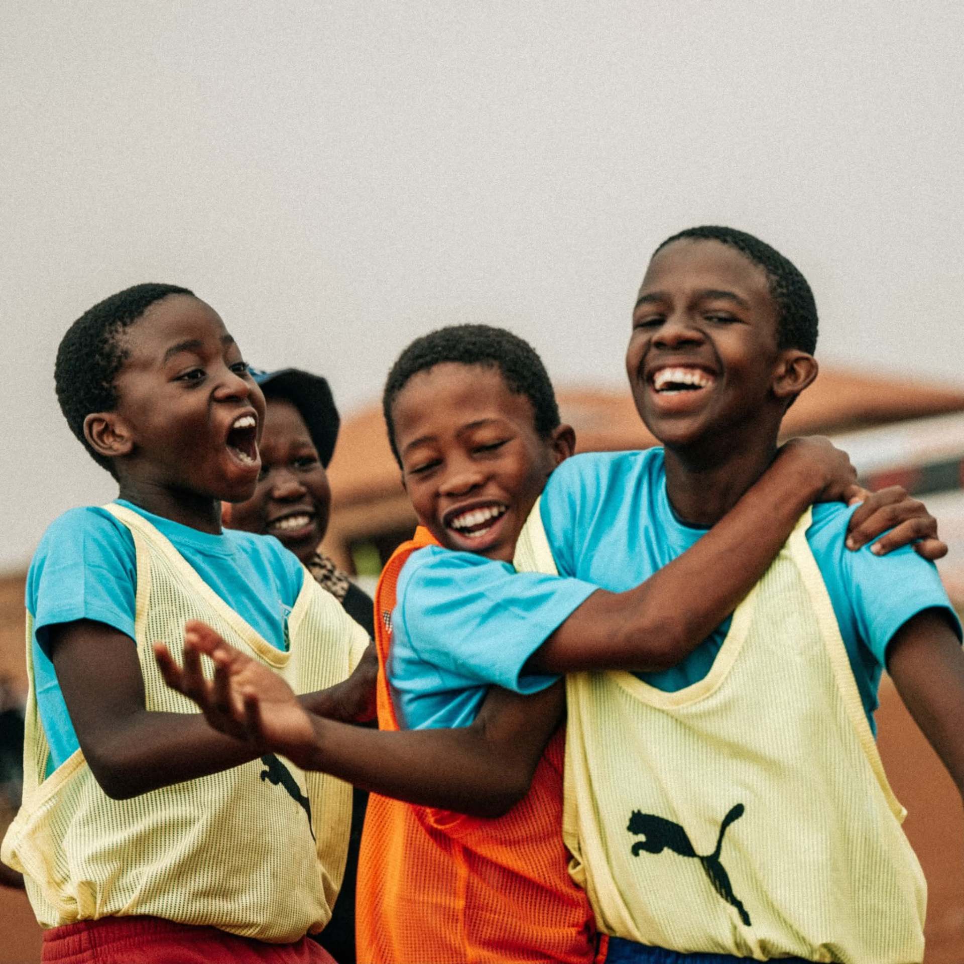 Children celebrating after a football match